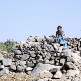 Young girl on Khost Province rock pile